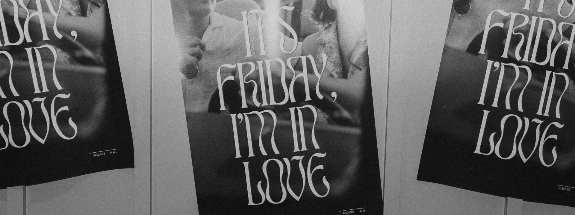 Black and white wedding sign reading 'It's Friday, I'm in Love' displayed at Hannah and Gunnar's garden-themed wedding reception at Historic 1625 Tacoma Place