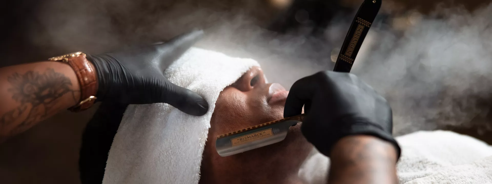 Man receiving groom barbershop pampering from JD Barba