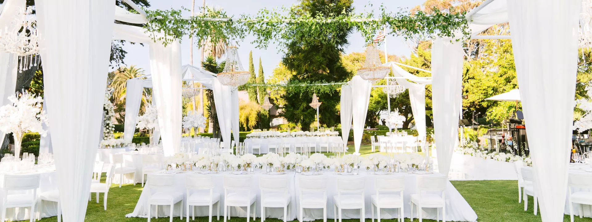 Discover how Tiana Belle and Todd Bryant’s ethereal wedding at Gulls Way featured a stunning all-white theme with colorful floral accents, a Zuhair Murad gown, and magical touches like fire dancers and personalized vows.