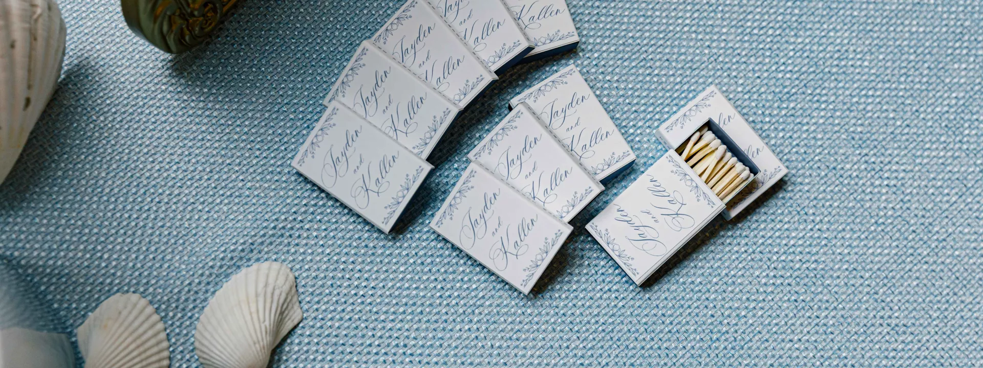 Custom matchbooks on blue tablecloth