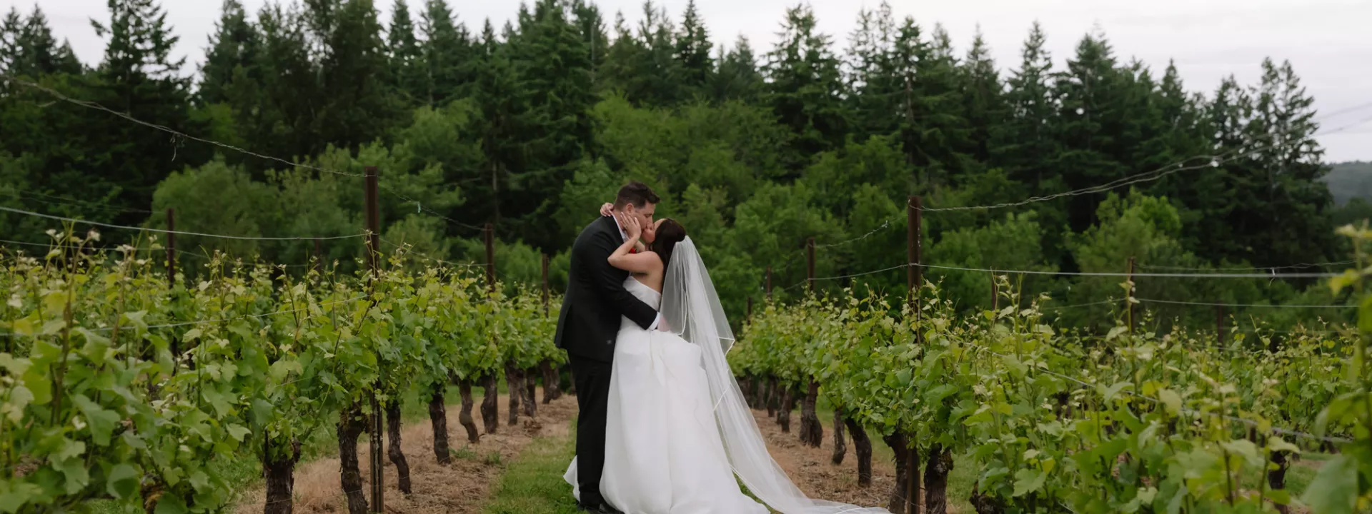 Amanda and Sam pose on the grounds of Oswego Hills Winery
