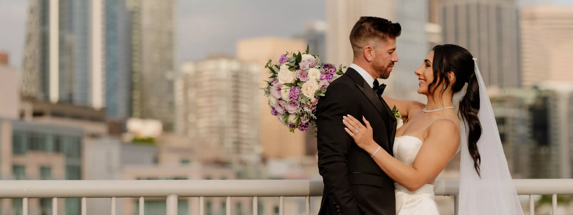 Donya and Rick embrace against scenic Seattle backdrop