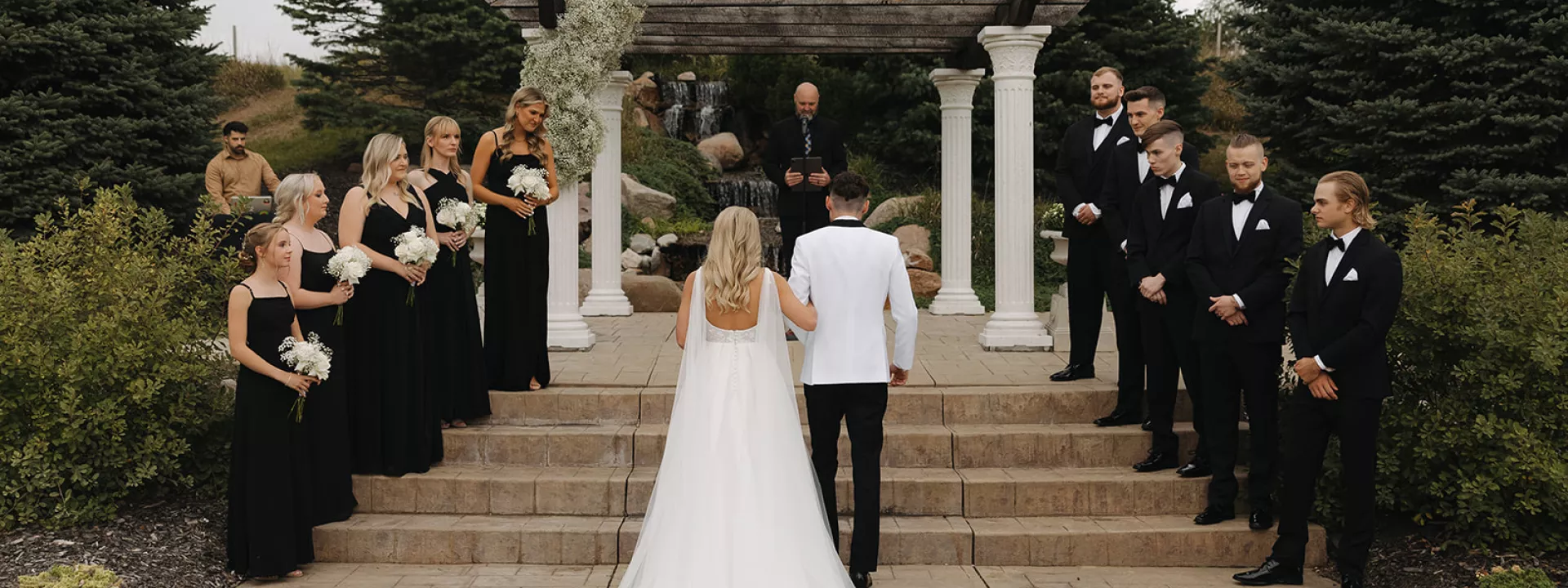 Bride and Groom Ascend Stairs in Wedding Ceremony