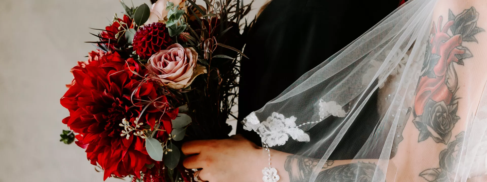 Close Up of Brittany and Daryian on their Wedding Day Featuring Moody Florals