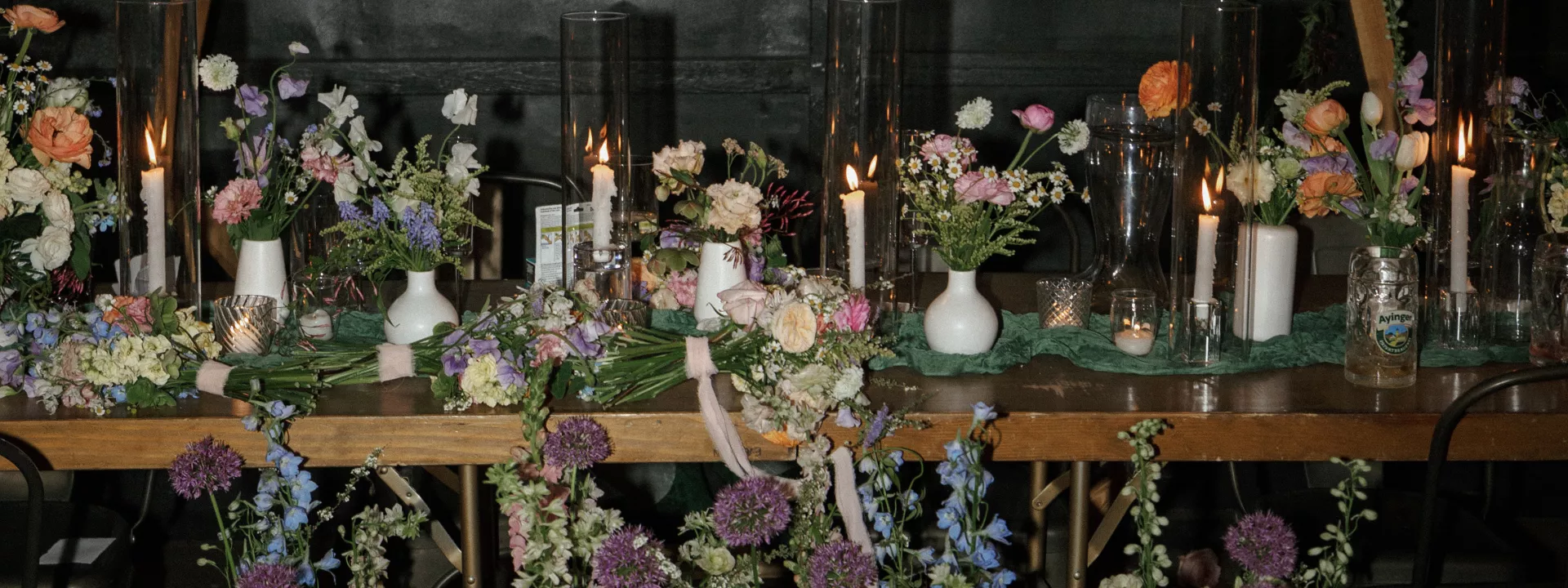 Verdant florals punctuate rustic table scape