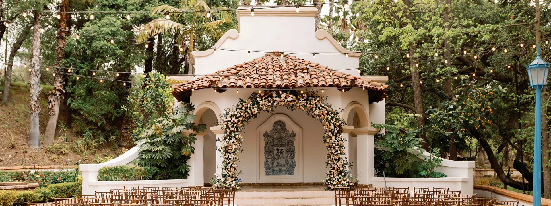 Ceremony space marked by soft florals at Rancho Las Lomas