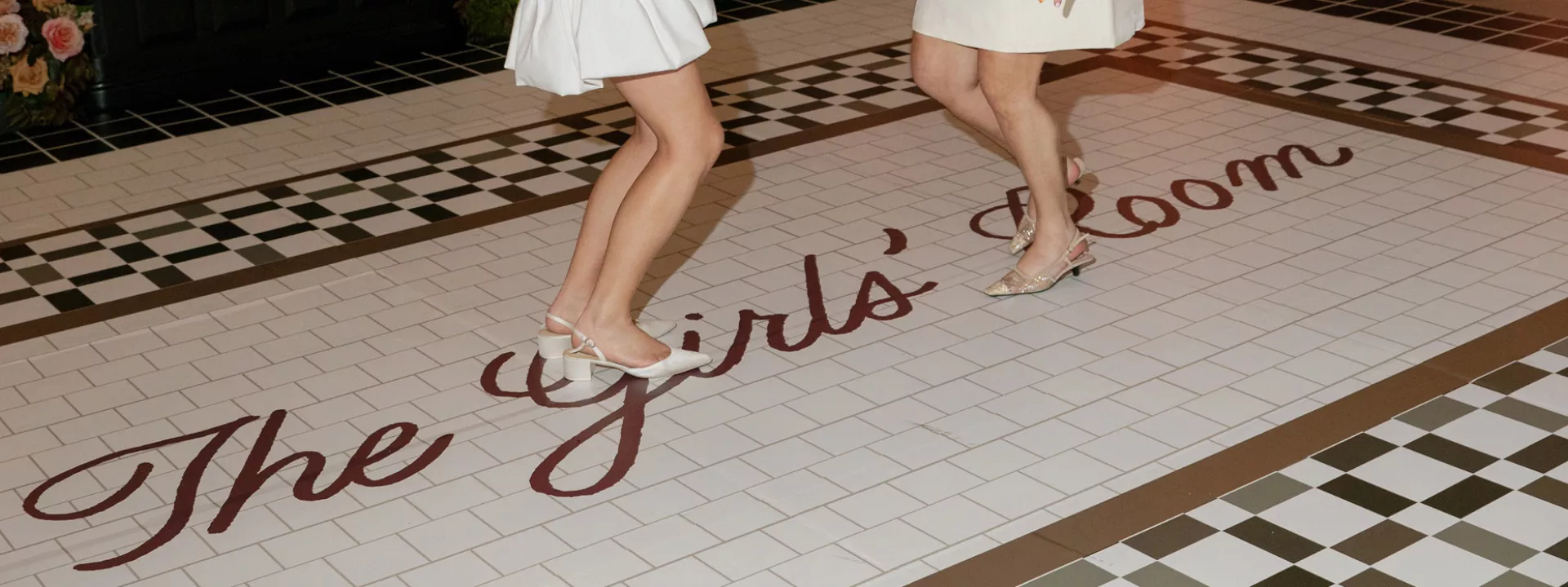 A shot of the custom "girl's room" dance floor at Lindsay and Natalie's winning wedding day