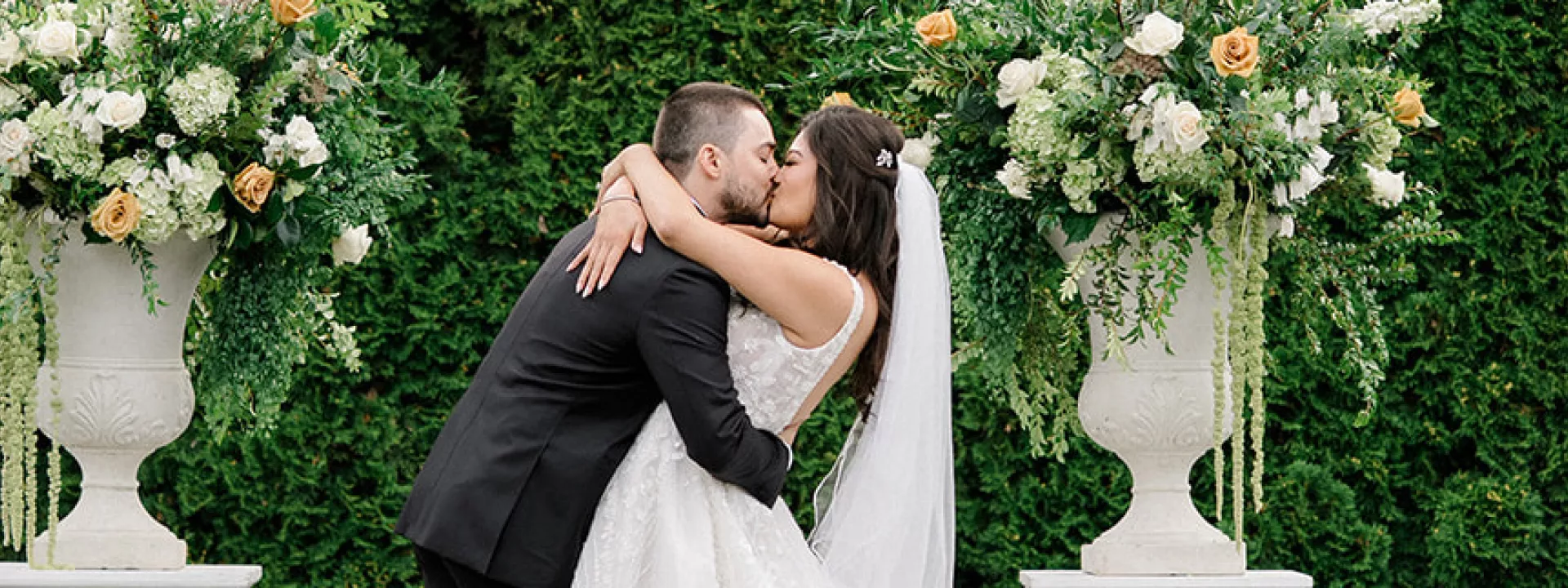 Paige and Nick seal their vows with a kiss in outdoor ceremony at Columbia Collective