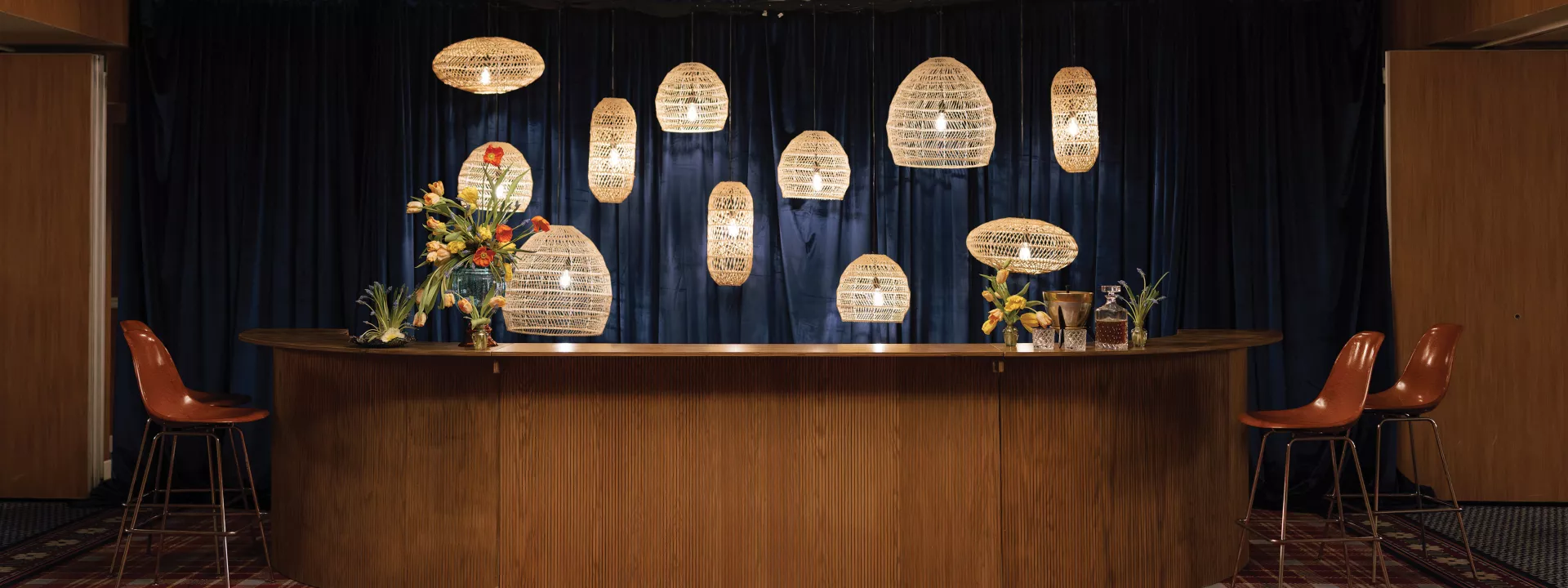 Retro-chic bar layout with modern lighting in editorial at Graduate 
