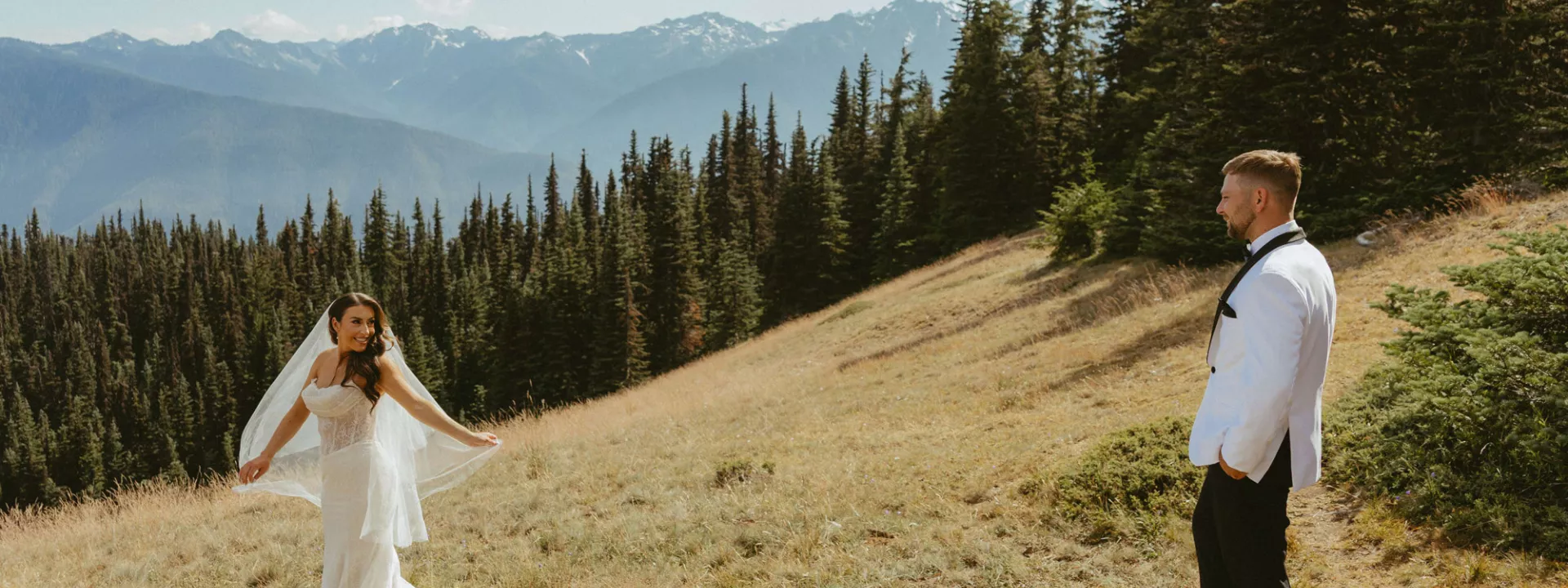Laney spins for Troy in her bridal attire, set against the scenic views of the Olympic Mountains