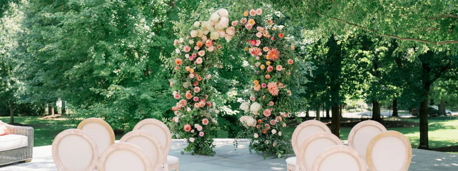 Ceremony set up featuring floral arch in the center