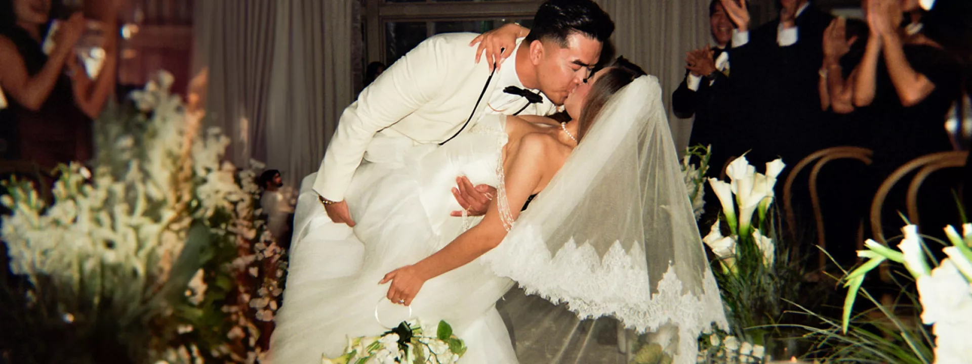 Helen and Tung kiss in the middle of the opulent aisle in their wedding day at Fairmont Olympic