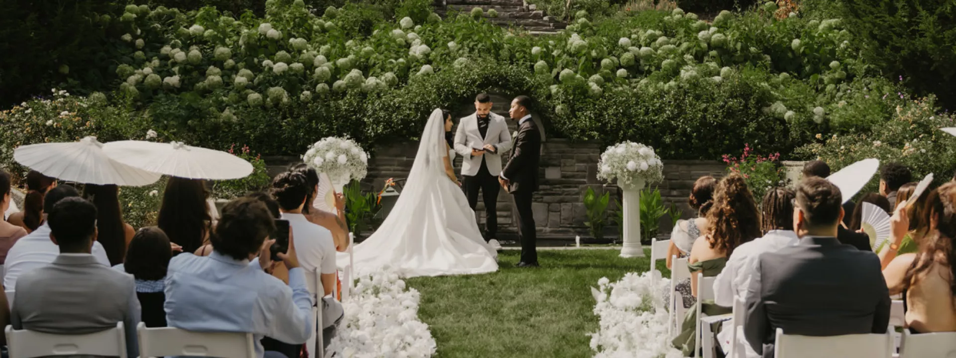 Jenny and Joseph stand at the outdoor altar during ceremony at Villa Terrace 
