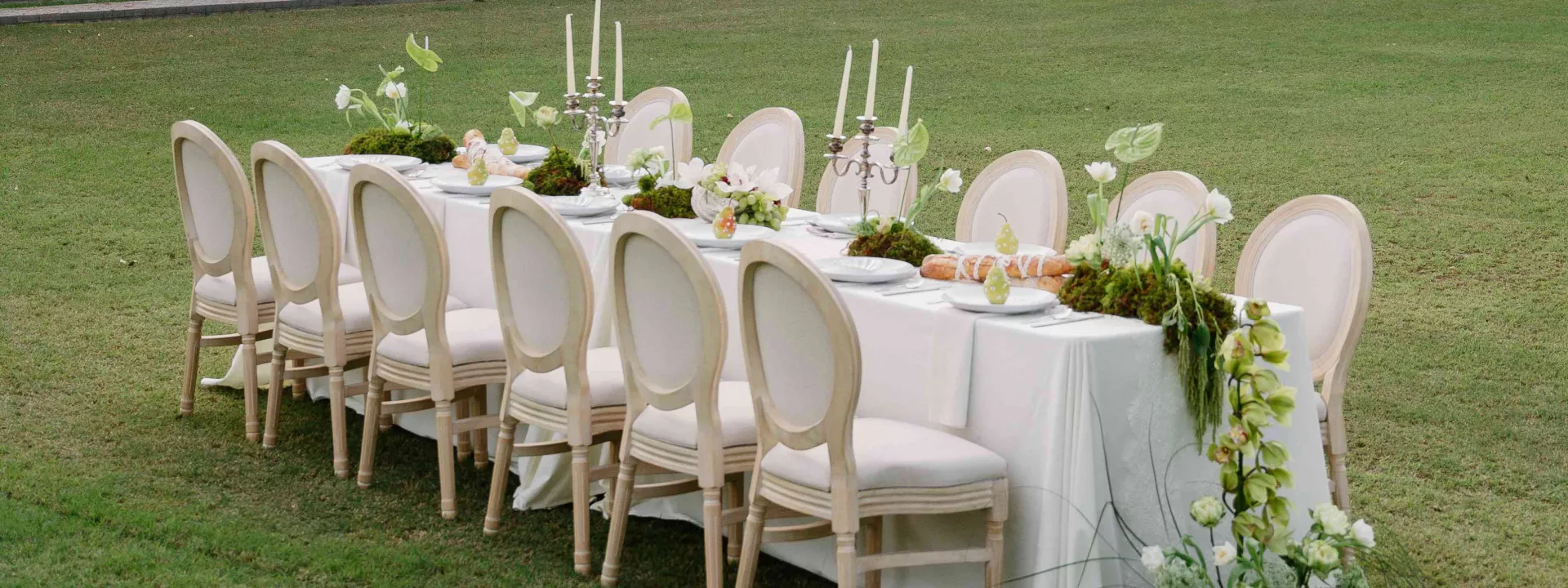 Monochromatic tablescape featuring lush greenery in editorial at private estate