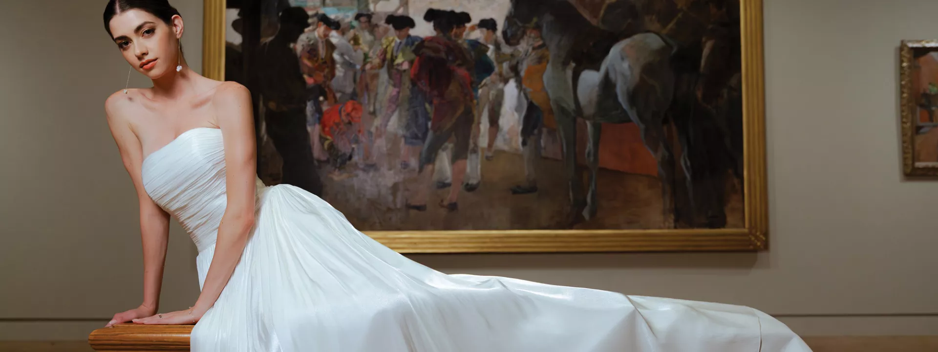 Model poses in bridal gown amidst artwork at Minneapolis Institute of Art