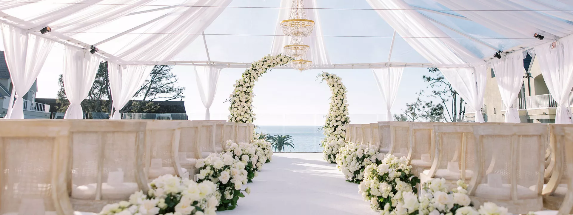 Monochromatic ivory ceremony scene at L'Auberge Del Mar