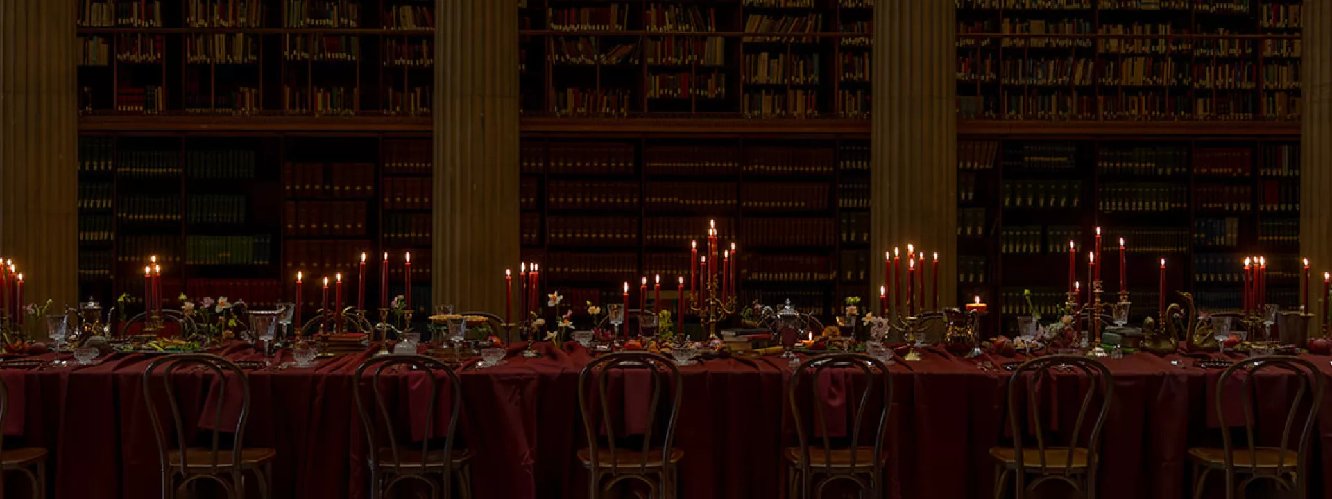 Candlelit reception table in wine hues at Avalon