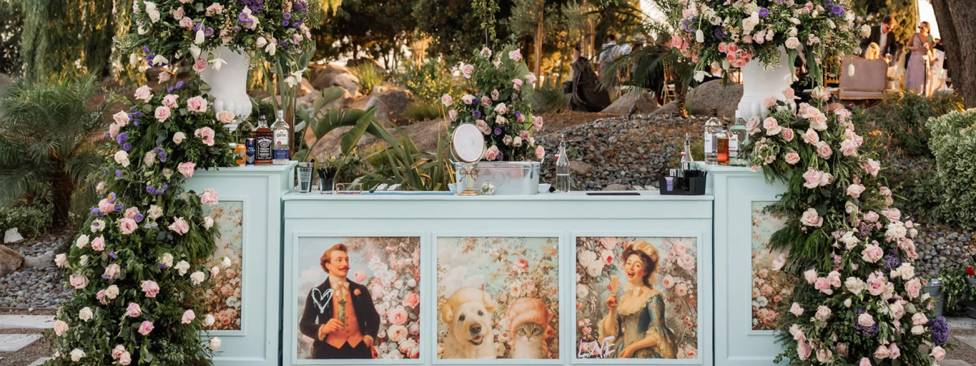 Outdoor bar decorated with flowers and a custom bar wrap
