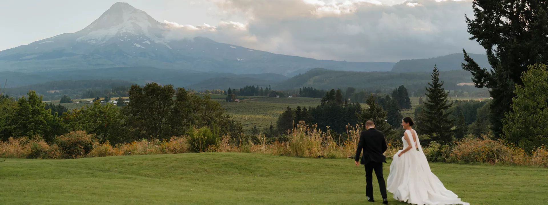 Maya and Scott walk the grounds of Mt Hood Organic Farms on their wedding day