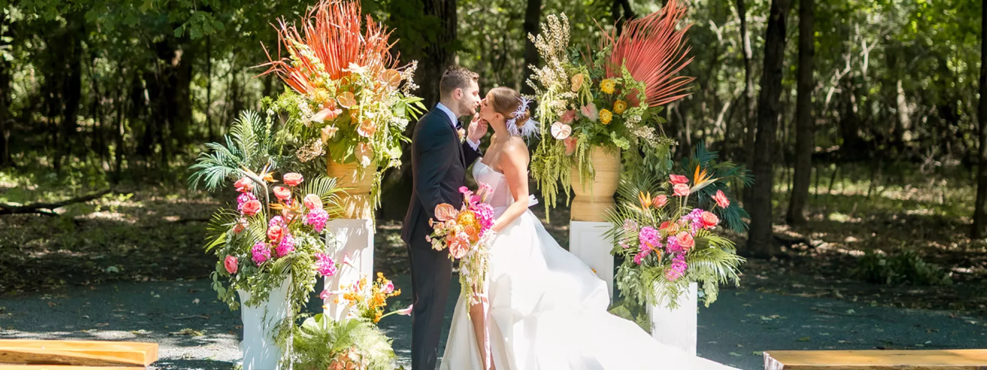 Birds of Paradise and tropical florals in lush altar space framing couple in Palm Springs-inspired editorial at Equestria West 