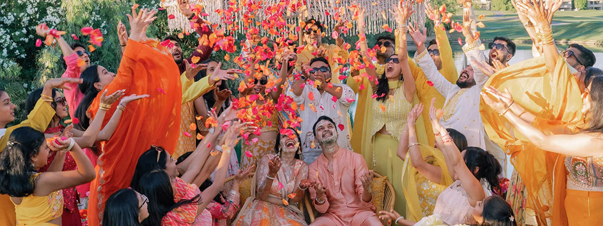 Bride and groom are showered in rose petals in celebratory opening evening for wedding weekend at Grand Hyatt Scottsdale REsort