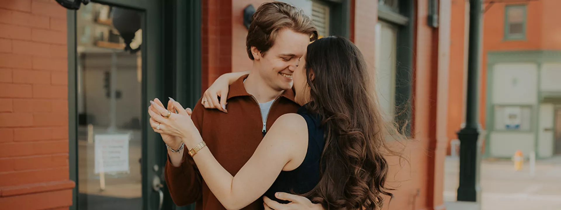 Olivia and Erik share a tender moment dancing during their engagement session with Caitlin & Camera