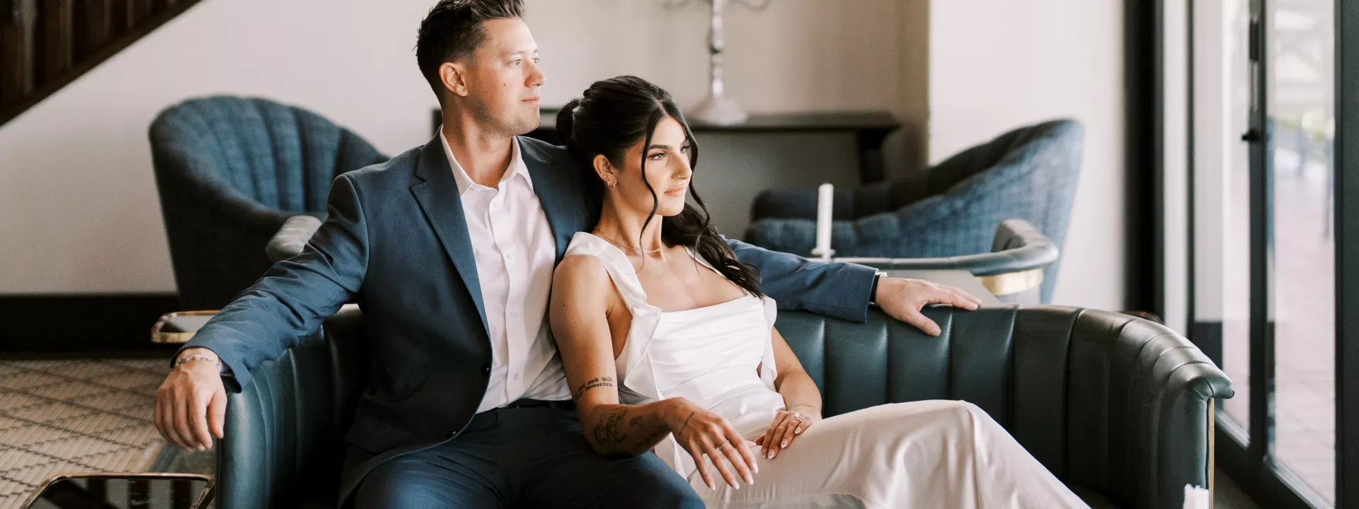 Moody-chic engagement session with a blue and orange color scheme at Wrigley Mansion