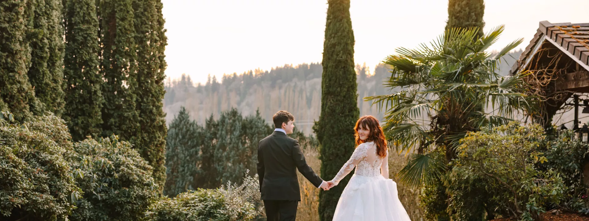 Lilly and Michael walk the grounds of Chateau Lill on their wedding day