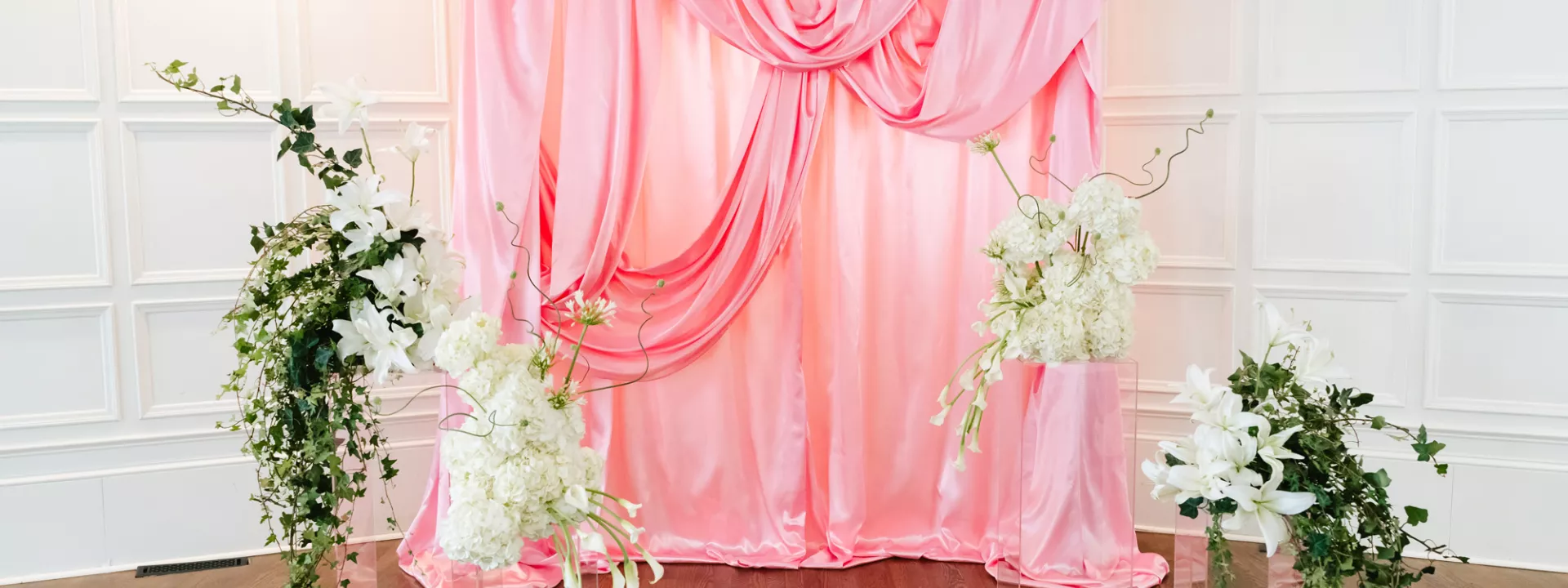Pink satin kitschy ceremony backdrop at St. Paul College Club