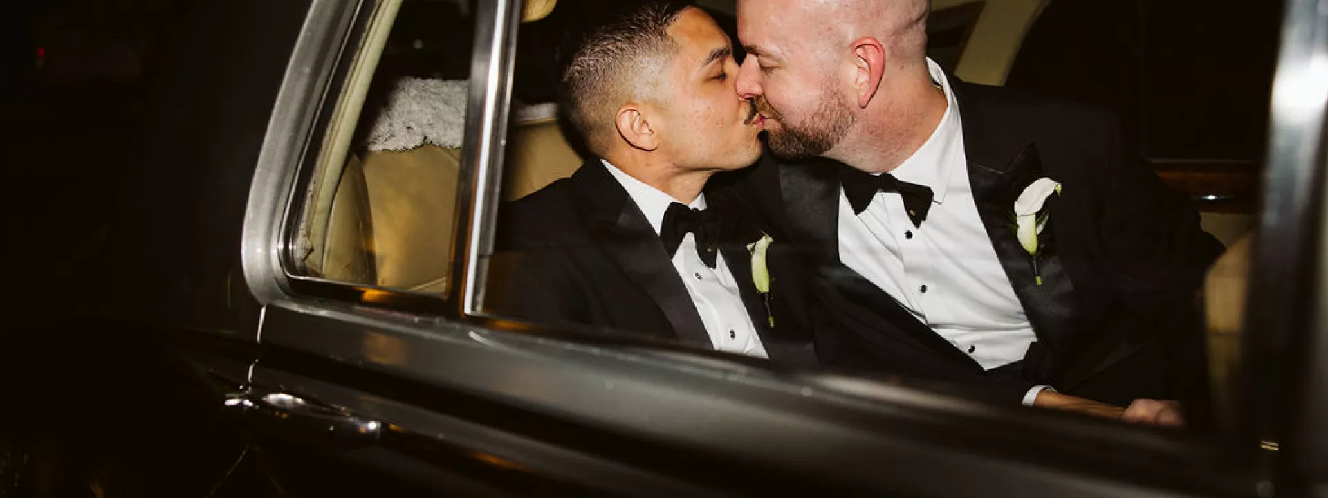 Kendall and Kyle kiss in their vintage getaway car on their wedding day