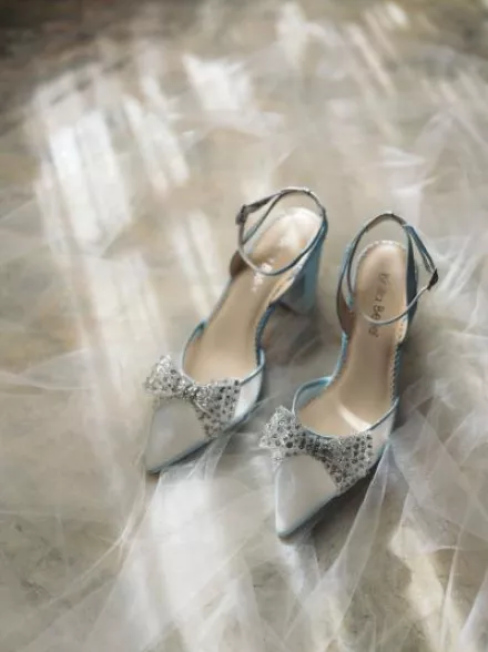 Model and pair of silver bridal Bella Belle Shoes from the Champagne Era collection