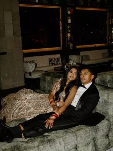 Nikita and Sahil pose before their reception in their opulent attire