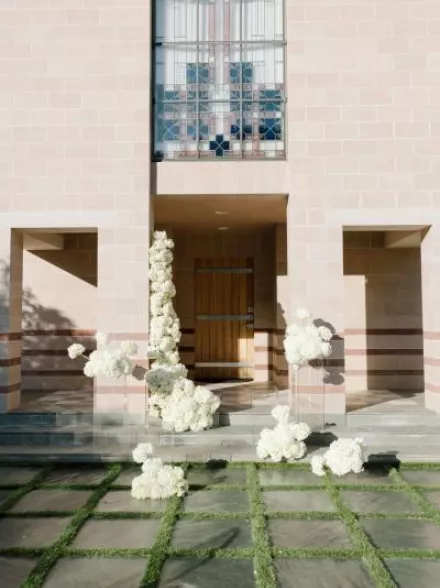 Cloudlike blooms form a modern altar on the lawn of new venue The Bird Estate