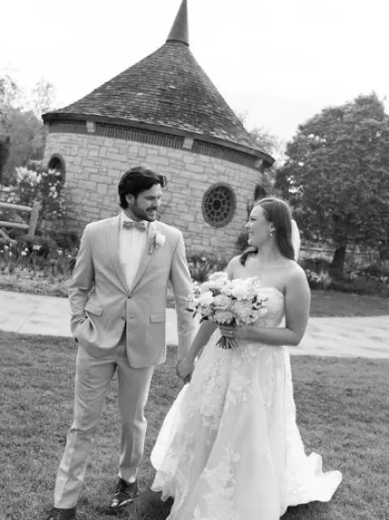Madelyn and Andrew glance at each other and walk on their wedding day