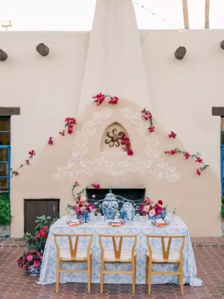 Bold and romantic reception table framed by the storied Hacienda del Sol