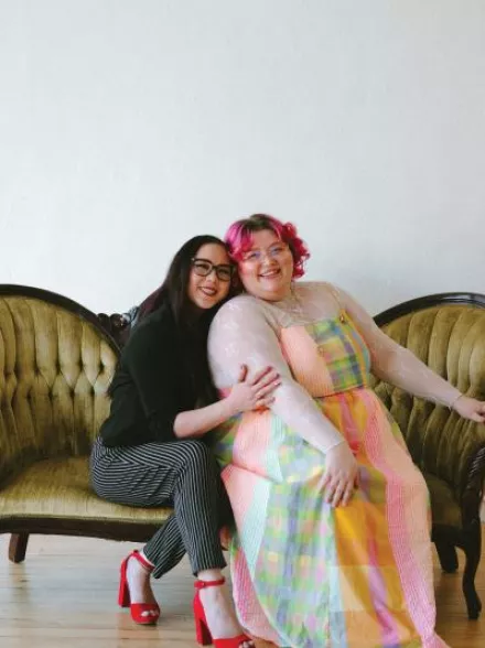 Owners of Honeybee Bridal pose for a photo 