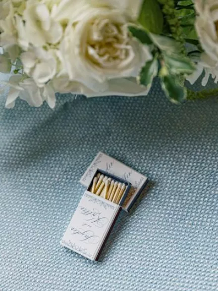 Custom matchbooks on blue tablecloth