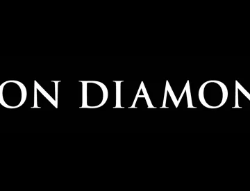 white Iron Diamond logo against black background